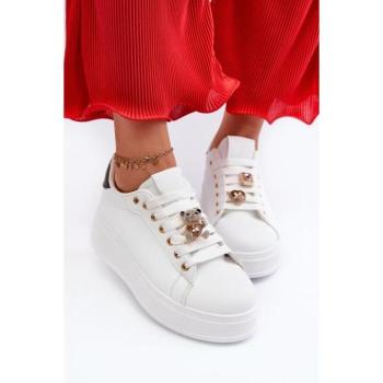 Női sportcipők - Fehér női tornacipők brossokkal kép